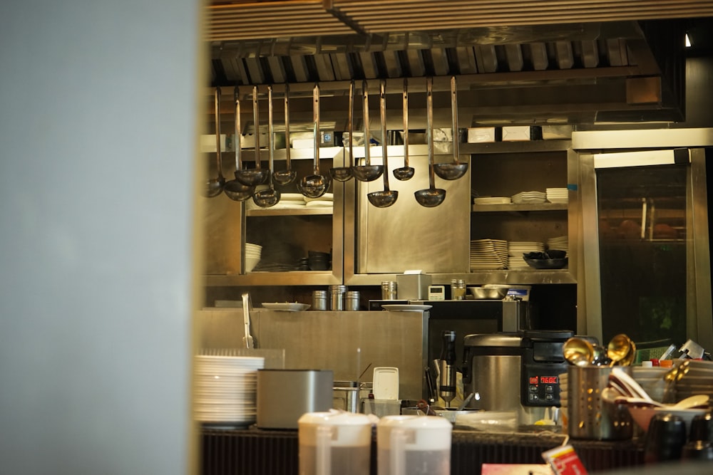 Spotless stainless steel restaurant kitchen, cleaned hood to floor